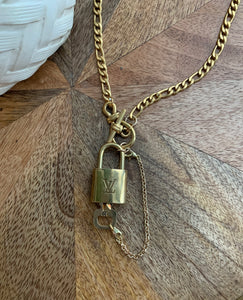 gold louis vuitton lock necklace